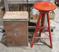 Adjustable red painted wooden bar stool and a Lloyd Loom style laundry bin