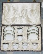 Cased Bisto bone china part coffee service for six, circa 1900, printed green factory marks, iron