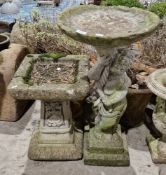 Two composite stone birdbaths, one circular with cherub pedestal, 82cm high x 41cm diameter and