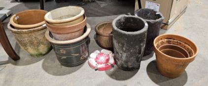 Collection of eleven garden pots, tallest 34cm high together with a cast iron Tudor rose, 21cm