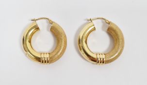 Pair of 9ct yellow gold hoop earrings, with a half textured finish, latch fittings, 2.8 cm diameter,