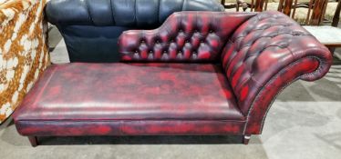 Chesterfield-style chaise longue with buttonback scrolling arm and back rail, with oxblood red