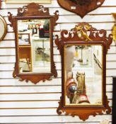 George III-style mahogany and parcel-gilt fretwork wall mirror, the shaped cresting surmounted by
