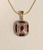 15ct yellow gold, ruby and diamond pendant, the central collet-set oval mixed cut ruby surrounded by