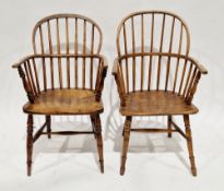 Matched pair of 19th century ash and elm comb back elbow chairs on turned legs with H-stretchers,
