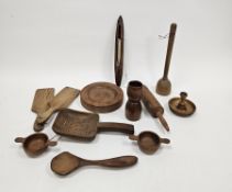 Collection of treen items including butter pats, rolling pin moulds, pie crimpers, spoons,
