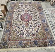 English wool pile cream ground carpet with central floral medallion on field of lions, tigers and