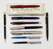 Collection of vintage ballpoint pens and a cased Parker fountain pen with 14K marked nib