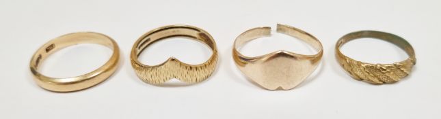 Three 9ct yellow gold rings including wedding band, size O 1/2 and two textured rings, sizes N 1/2