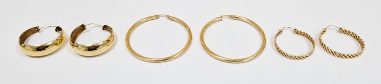 Three pairs of 9ct yellow gold hoop earrings, one pair of pierced cross-hatch design, another pair