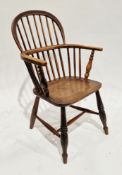 19th century elm and ash double comb back elbow chair on turned baluster legs with a H-stretcher,