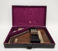 Early 20th century wooden cased German autoharp with label 'Made in Saxony for Keith Prowse & Co