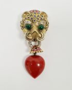Gem set leopard's head brooch in the style of Cartier, the head surmounted with three rows of pear-