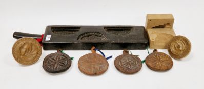 Two 19th/early 20th century treen butter moulds both with acorn and oakleaf design, a two-section