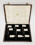 Cased set of Art Deco silver sandwich markers, comprising six hallmarked silver flags and a quantity