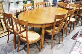Modern French cherrywood dining room suite retailed by La Boutique du Meuble, comprising an oval