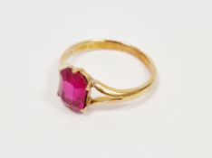 18ct yellow gold and ruby dress ring, the claw set emerald cut ruby approximately 10mm high, held on