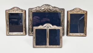 Four silver rectangular easel back photograph frames, all by Carrs of Sheffield, the frames having