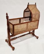 19th century mahogany and bergere swing rocking cradle/crib of gothic revival style, the ogee arched