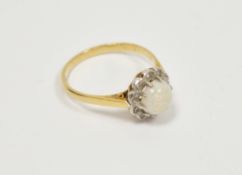 18ct yellow gold opal and diamond cluster ring, the round claw-set cabochon white opal set in a