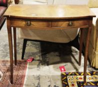 Mahogany-effect bowfronted side table in the Regency manner, the two frieze drawers with brass