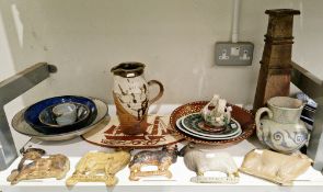 Collection of studio pottery items including an earthenware slip decorated dish, with a peacock on a