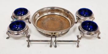 Set of four silver-plated salt cellars of circular form with beaded edge, raised on three hoof feet,