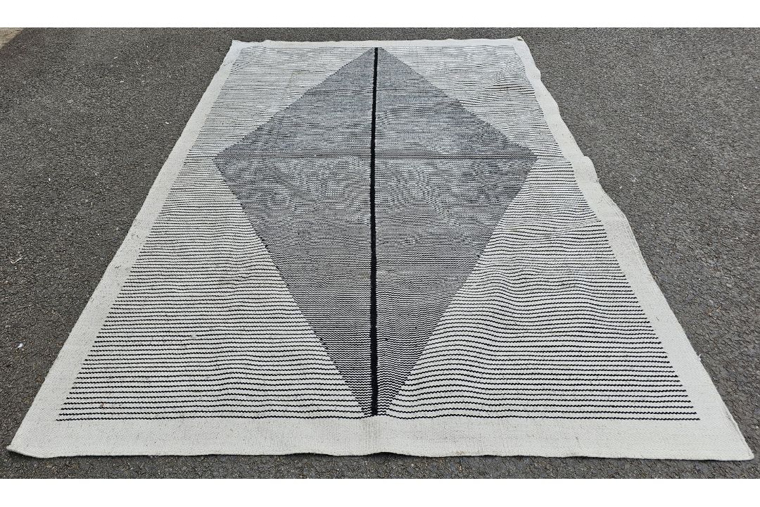 Large modern cream ground rug with large striped lozenge medallions, on striped field, 293cm x 198cm