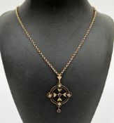 Edwardian yellow metal, amethyst and seed pearl pendant of round open work design, 4.5cm high