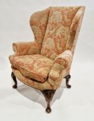 Wingback armchair in the George III manner, upholstered in a pink and cream Indian elephant and