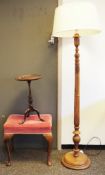 South East Asian teak standard lamp, the column carved with flowers on a circular base, 146cm
