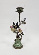 20th century continental porcelain model of a bird perched on a gilt metal candlestick branch, on