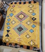 Large Indian yellow ground rug with two central lozenge medallions on geometric field, 230cm x 160cm