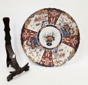 Japanese Meiji period (1868-1912) Imari pattern fluted charger on wooden stand, painted to the