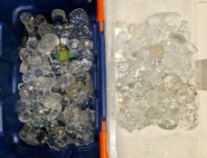 Two boxes of decanter stoppers, variously cut and engraved including 20th century examples of