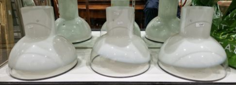 Set of three Peill and Putzler opaque and clear glass lightshades of circular form, with narrow