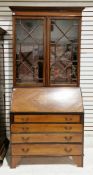 Edwardian mahogany bureau bookcase in the George III style, having ebony and satinwood inlay, the
