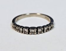 Platinum and diamond half eternity ring, comprising a row of nine claw-set graduating diamonds, size