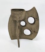 Studio pottery vase of abstract form pierced with three circular apertures, abstract stoneware