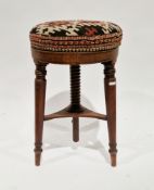 19th century mahogany adjustable piano stool, the circular upholstered seat adjustable on a screw