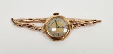 Lady's 9ct gold wristwatch with expanding bracelet, the turned circular parcel-gilt dial with arabic