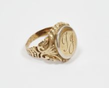 9ct yellow gold signet ring, the oval cartouche engraved with initials having a white metal rim, the