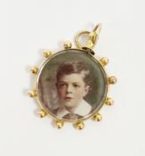 9ct gold-mounted photographic portrait pendant, circular, reversible and set with ball decoration,