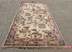 Chinese style cream ground carpet with three geometric medallions on field of branching trees,