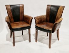 Pair of contemporary brown and black leather upholstered chairs with arms, on stained pine square