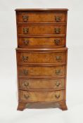 20th century small bowfronted chest on chest in the George III-manner, having seven graduated