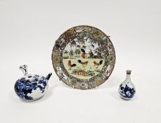 Japanese porcelain blue and white teapot of globular form, early 20th century, painted with leafy