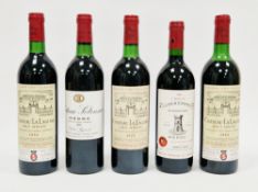 Three bottles Chateau La Lagune Haut Medoc Grand Cru Classe (two of 1984, 1 of 1975), a bottle of