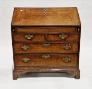 George III oak bureau, the fall-front opening to a fitted interior of pigeonholes, drawers and