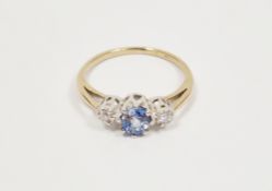 Ceylon sapphire and diamond ring, the yellow metal ring set oval sapphire to the centre flanked by
